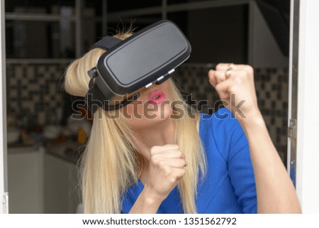 Woman playing VR device on a light background