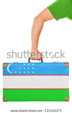 The Uzbek flag on a suitcase. Isolated on white.