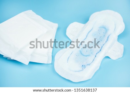Sanitary napkins pad for women on color background.