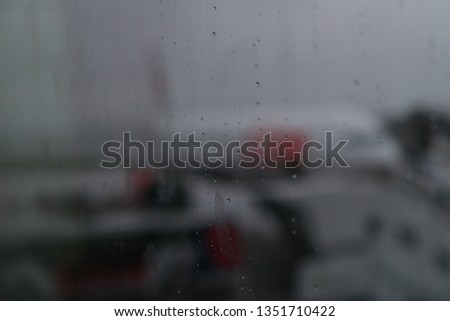 rain water on the glass with the background of the plane