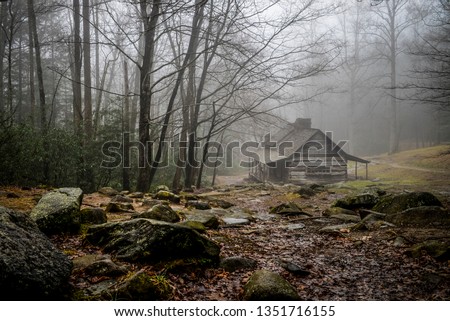 Old log cabin in the woods. Royalty-Free Stock Photo #1351716155