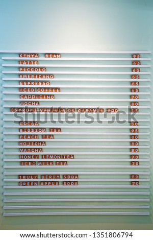 Beverage menu with price lists hanging on the wall