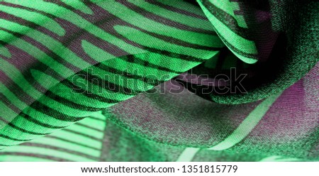 texture background pattern wallpaper. Green pink black silk fabric pattern. This medium-weight rayon fabric has a nice shine with slight color variations. Perfect for adding elegance to your designs
