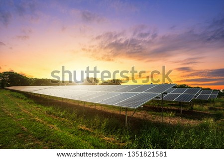 Solar panel cell on dramatic sunset sky background, 
clean Alternative power energy concept. Royalty-Free Stock Photo #1351821581