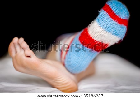 Stripped sock and bare foot