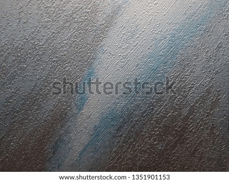 nacreous with brown and blue stains background