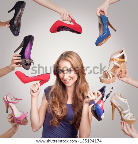 Portrait of beautiful young woman with shoes Royalty-Free Stock Photo #135194174