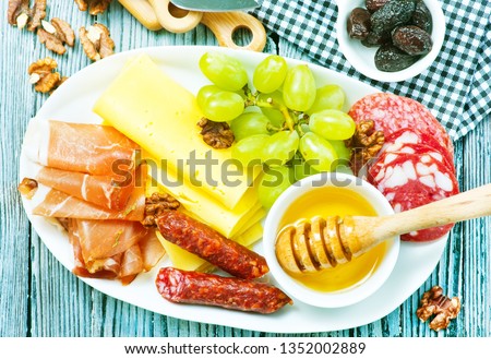 antipasti on white plate and on a table