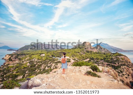 .Young beautiful girl traveling along the coast of the Mediterranean Sea.