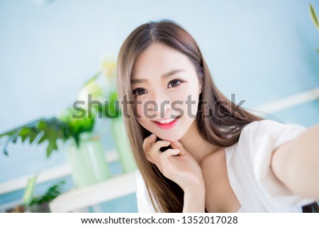 beauty asian woman take a selfie at home