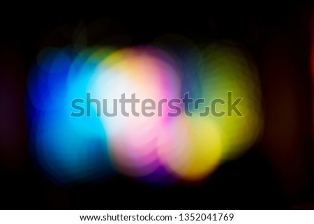 Colorful bokeh lights on a black background.