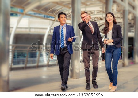 Business man and businesswomen over blurred city background, Success and Happiness Team Concept