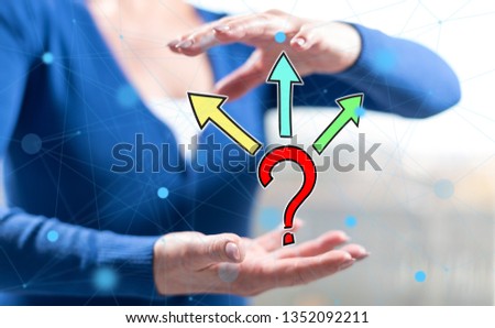 Choice concept between hands of a woman in background