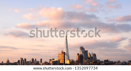 Elevated panorama of London city skyline at sunset