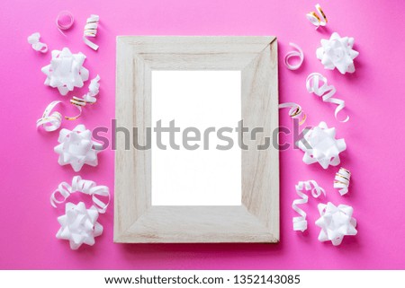 Photo frame mock up with space for text, white confetti on blue background. Lay Flat, top view. Valentine's , birthday background. celebration .
