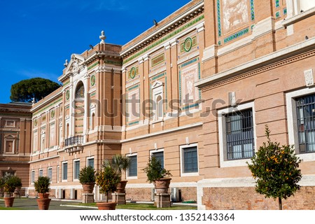 Scenic picture of beautiful historical building's facade against blue sky in Rome, Italy
