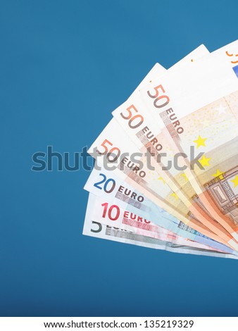 european currency euro banknotes on blue background