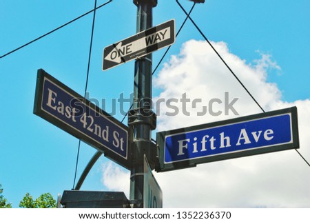 Street sign of Fifth Avenue and East 42nd street in summer in New York City - road direction in Manhattan downtown Americas most famous and popular city - image
