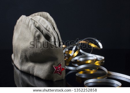 May 9! Russia victory day. Military cap on a black background.