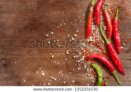 Red Pepper,Sea Salt ,Red Chili ,Green Pepper On Wood  Royalty-Free Stock Photo #1352256530