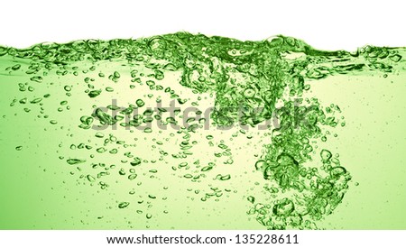 green soda drink with bubbles