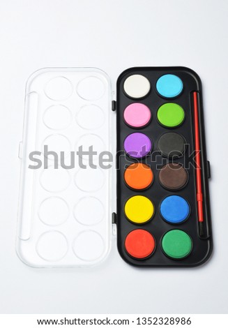 Watercolor paints box on white background