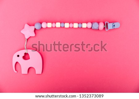 Flat lay elephant baby pacifier holder. Pacifier clip with place for baby name.