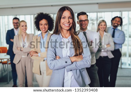 Group of happy business people and company staff in modern office, representig company.Selective focus. Royalty-Free Stock Photo #1352393408
