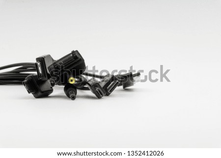 Universal recharger head isolated on white background. Selective focus and crop fragment