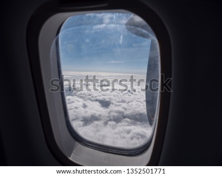 Beautiful clouds seen thru an airplane window