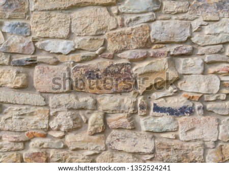 Texture of a stone wall. Old castle stone wall texture background. Part of a stone wall, for background or texture