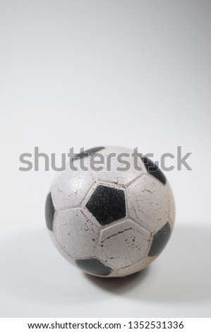 an small old football ball.