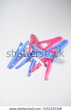 colorful clothespins on white background