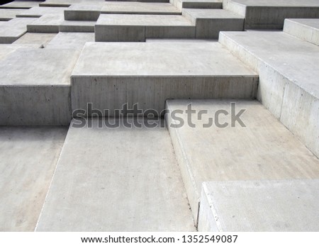 grey modern geometric cubic concrete steps forming angular patterns and shapes