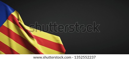 Valencian Community flag cloth on dark background
