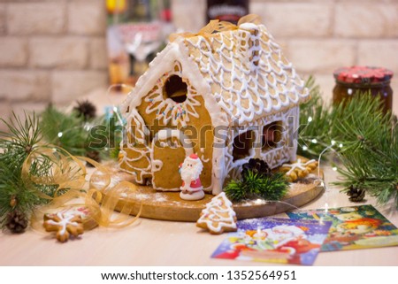 Beautiful gingerbread house for Christmas. Decorated for the holiday. Handmade.
Happy New Year