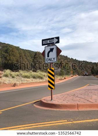 Road signs - one way and turn