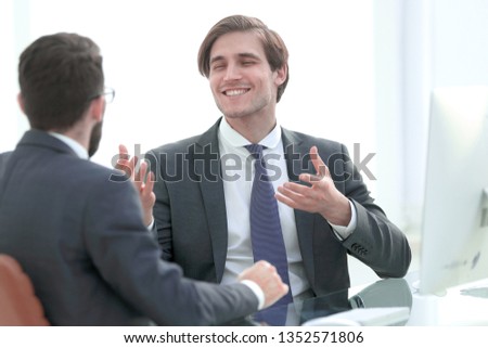 young business partners shake hands