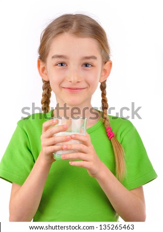 Beautiful blonde girl drinking milk from glass. Isolated on white background.