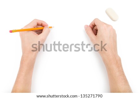Left-hander with pencil writing something. Isolated on white Royalty-Free Stock Photo #135271790