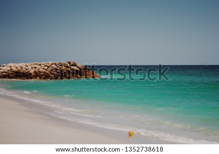 Australian beach in Perth. Quinns rocks suburb. Summertime. Stone jetty