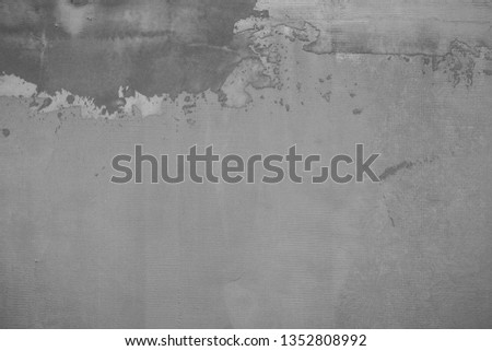 The texture of the old cement wall with scratches, cracks, dust, crevices, roughness, moss. Can be used as a poster or background for design.