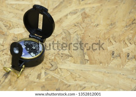 
Compass on wooden floor