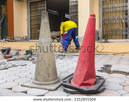 Traffic Funnel or cone on street construction site. Warning sign show that this area under construction work.