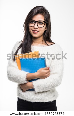 Indian student holding book on white background