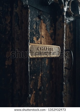 Wooden Door with Metal Name Sign and Door Handle - Image