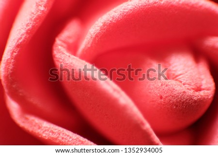 Red rose in soft style for background. Rose petals closeup. Texture of artificial colors. Crimson, red background.