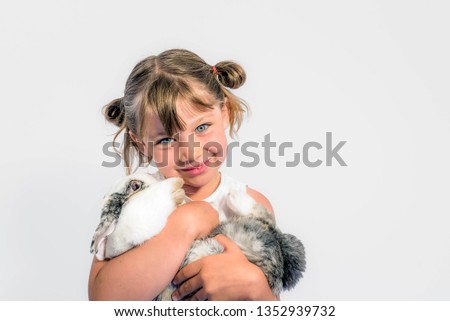 beautiful girl with her pet rabbit