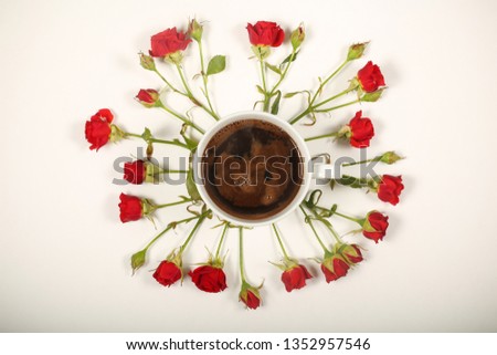 hot coffee is on a white background are flowers around the roses