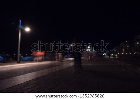 Blurred picture, with people and street lights, Kalamata, Greece.